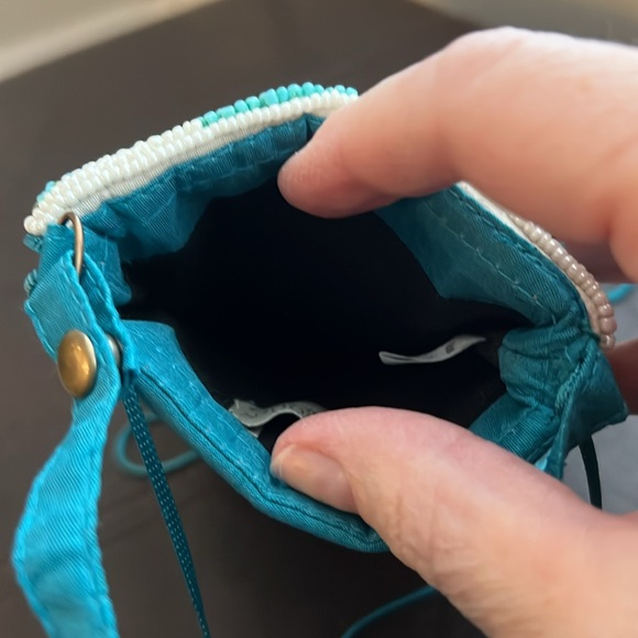 crossbody or clutch. zippered part to hold money/cards. Top slip for phone. - Picture 4 of 4